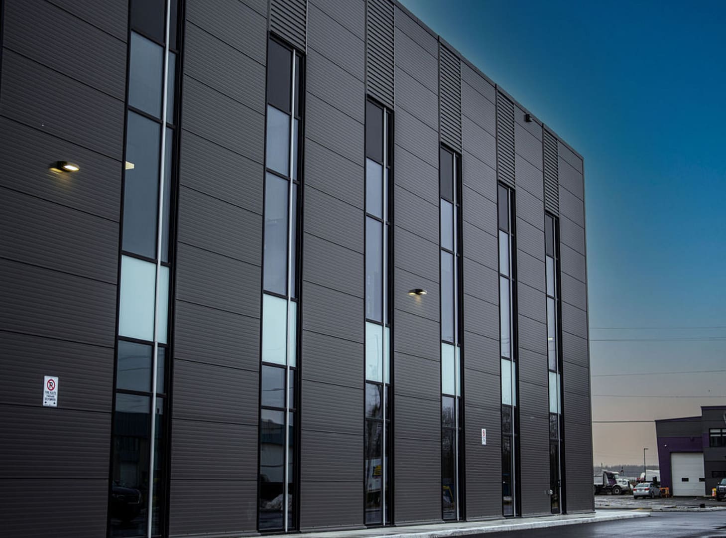 23 Modern industrial facade with metal cladding and glass windows