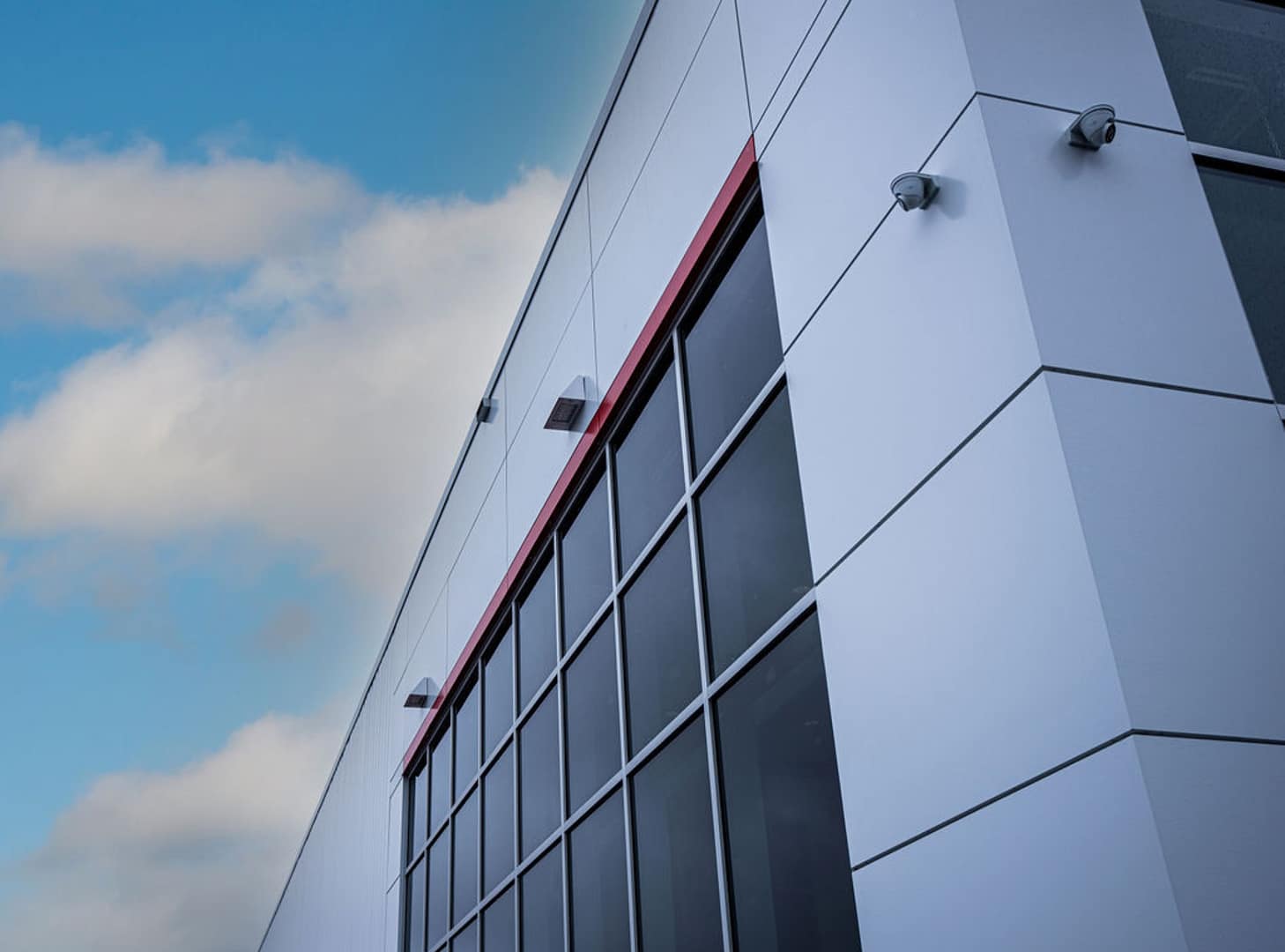 37 Close-up of facade with white ACM panels and glass windows