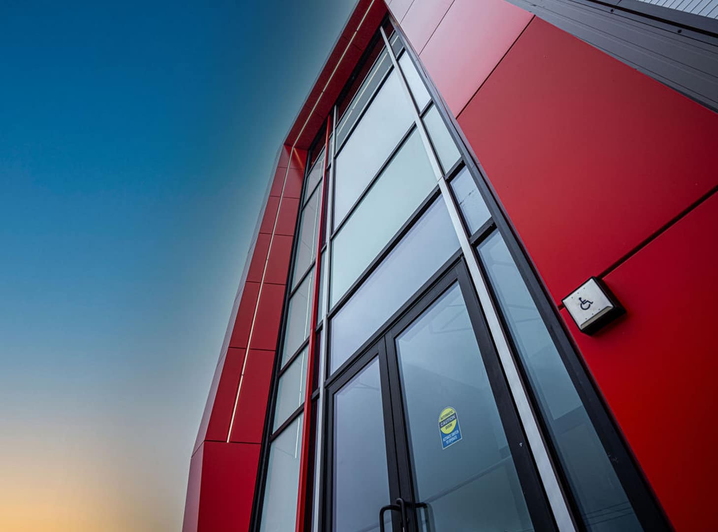 Factum Builders blueprint 1 Facade with red cladding and tall windows