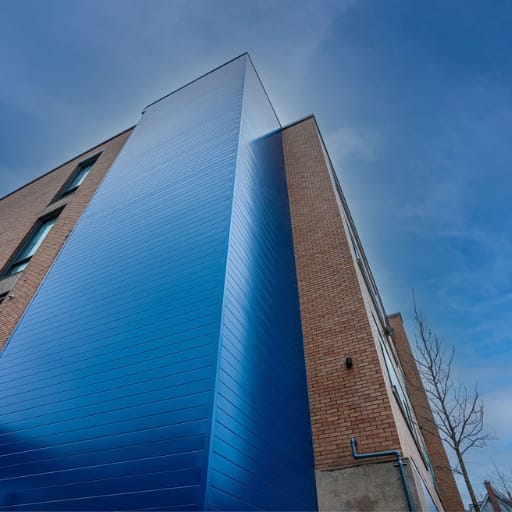 2 Brick commercial building with vertical blue cladding accent