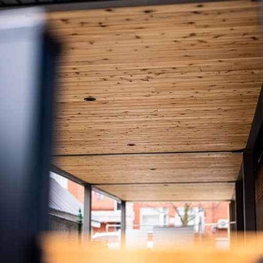 Untitled design Outdoor walkway with wood ceiling panels